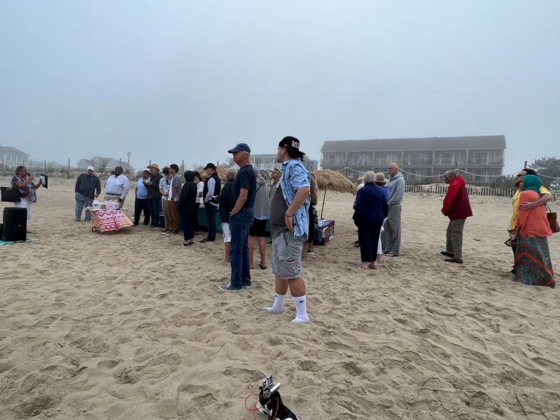 Sussex Health and Environmental Network co-founder Maria Payan, left, addresses the Beach Bash crowd.